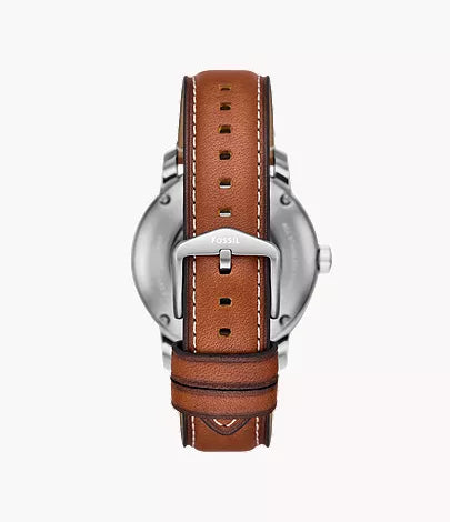 Caseback view of Fossil Inscription watch with brown leather strap and white stitching