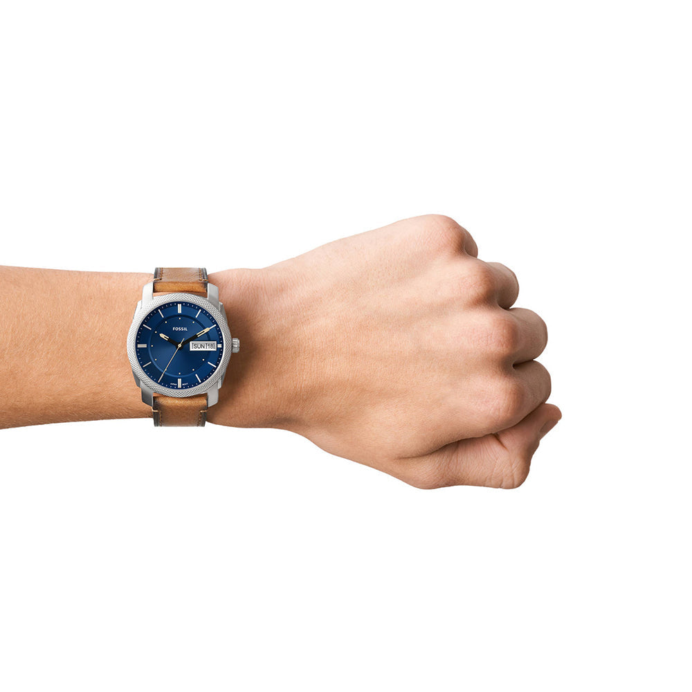 Fossil Machine FS5920 watch worn on wrist with tan leather strap and blue dial
