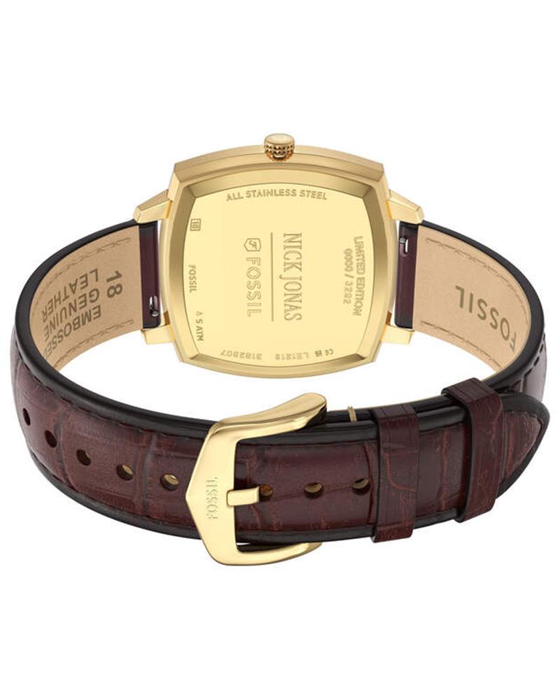 Gold-tone caseback engraved with Fossil logo and watch specifications