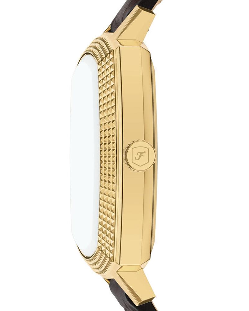 Side view showing gold-tone textured case with black leather strap