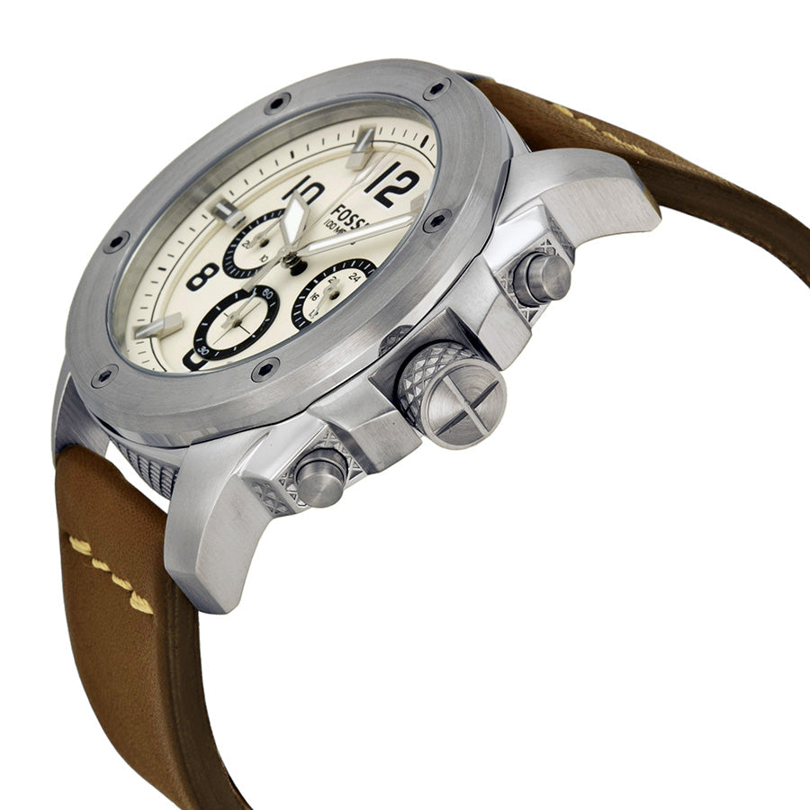 Fossil Modern Machine chronograph watch on wrist with brown leather strap and silver case