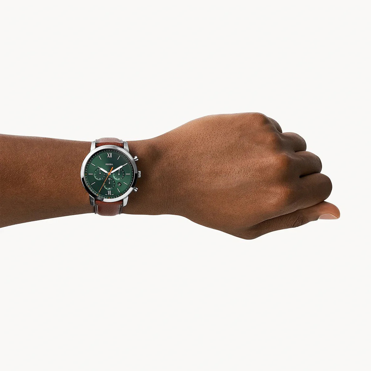 Fossil Neutra FS5902 chronograph watch worn on wrist with green dial and brown leather strap