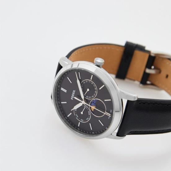 Fossil Neutra FS5904 watch with brown leather backing visible, showcasing case and strap