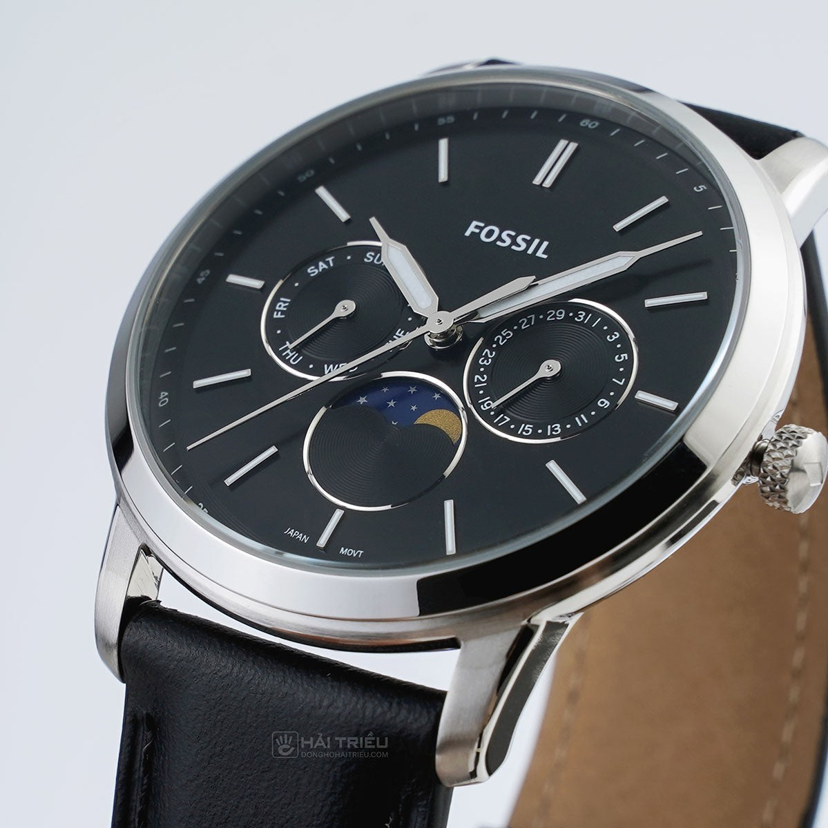 Fossil Neutra FS5904 side angle view showing moonphase indicator and tan leather backing