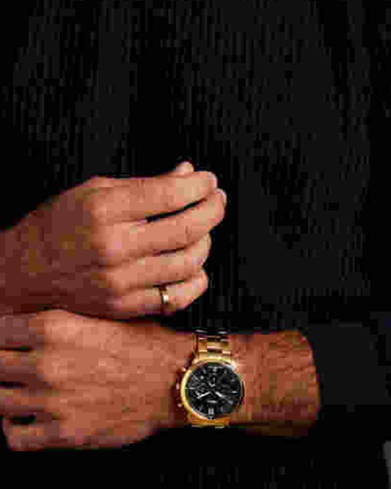 Fossil Neutra gold-tone chronograph watch worn on wrist