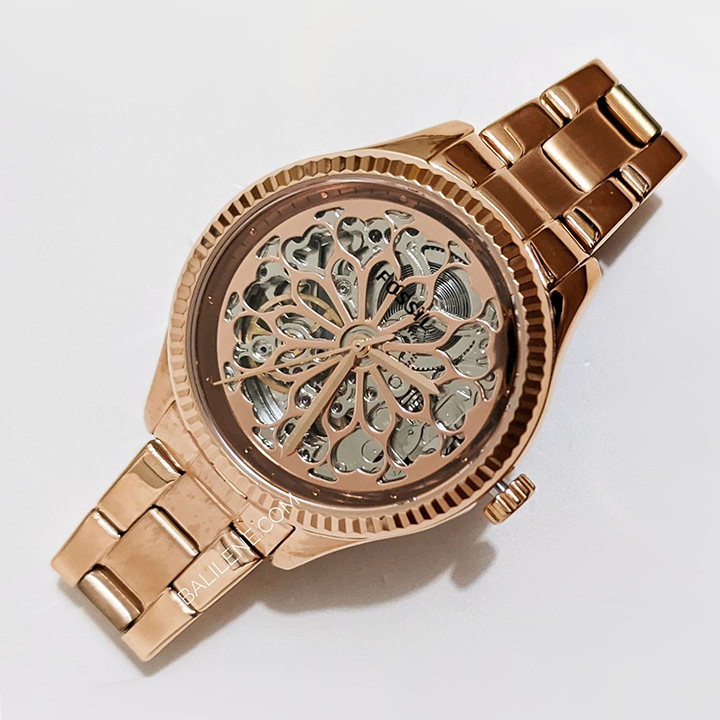 Close-up of Fossil Rye skeleton dial showing intricate mechanical movement and rose gold case bezel