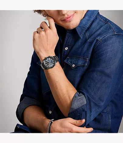 Fossil Everett Chronograph smoke watch worn on wrist with stainless steel bracelet