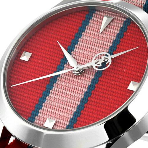G-Timeless 38mm dial close-up with red stripe pattern and hour markers