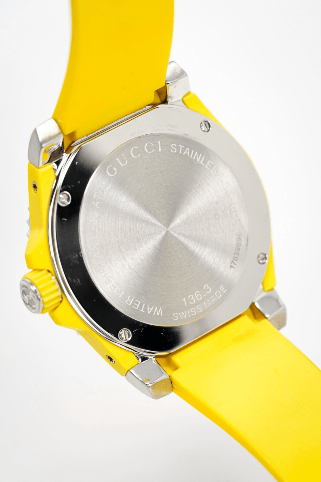 GUCCI Dive caseback showing stainless steel with engraved text and water resistance rating