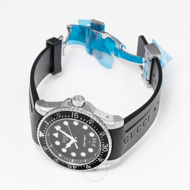 GUCCI Dive 45MM watch displayed at angle showing black rubber strap with stainless steel clasp