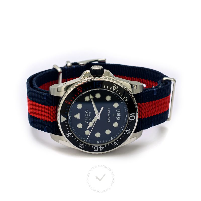 Gucci Dive watch worn on wrist showing blue and red nylon strap detail