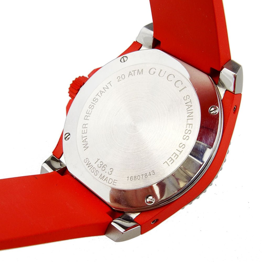 Gucci Dive caseback displaying water resistance, Swiss made, and technical specifications