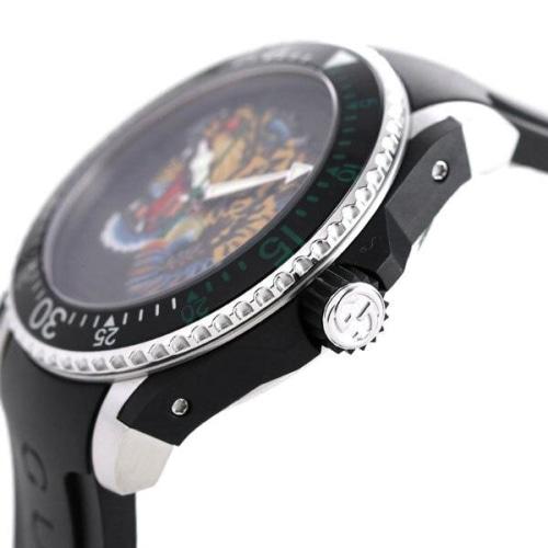 Gucci Dive watch side profile with tiger-motif dial, stainless steel and black rubber construction