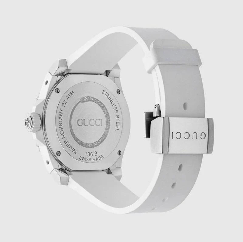 Gucci Dive caseback showing water resistance, serial number, and white rubber strap