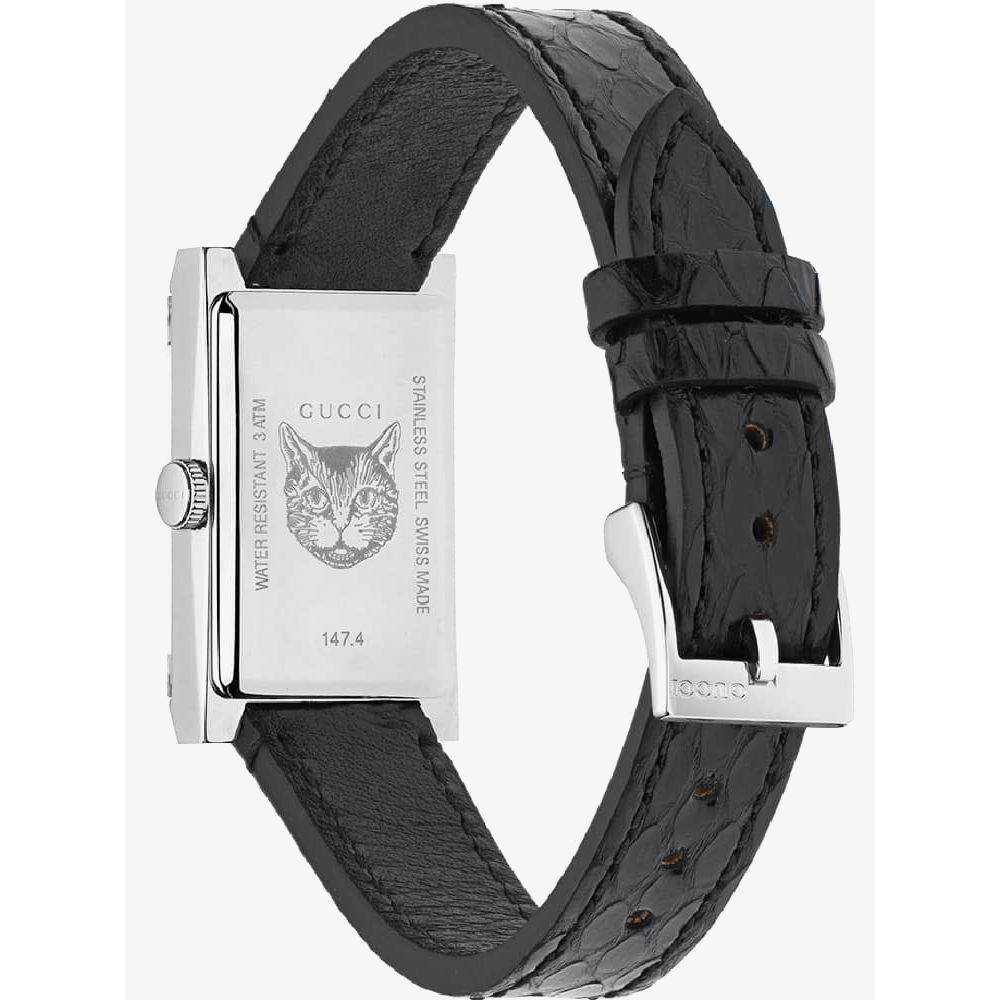 Gucci G-Frame mother of pearl dial watch on wrist with black leather strap
