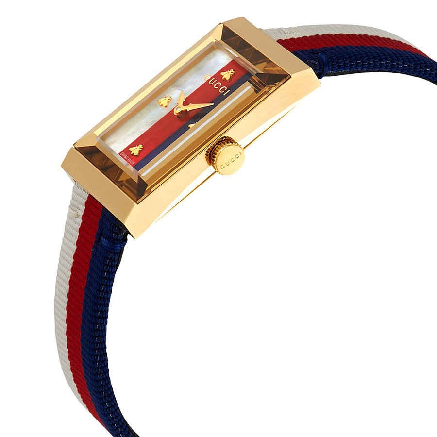 Angled view of Gucci G-Frame watch displaying gold case, mother of pearl dial with striped nylon strap