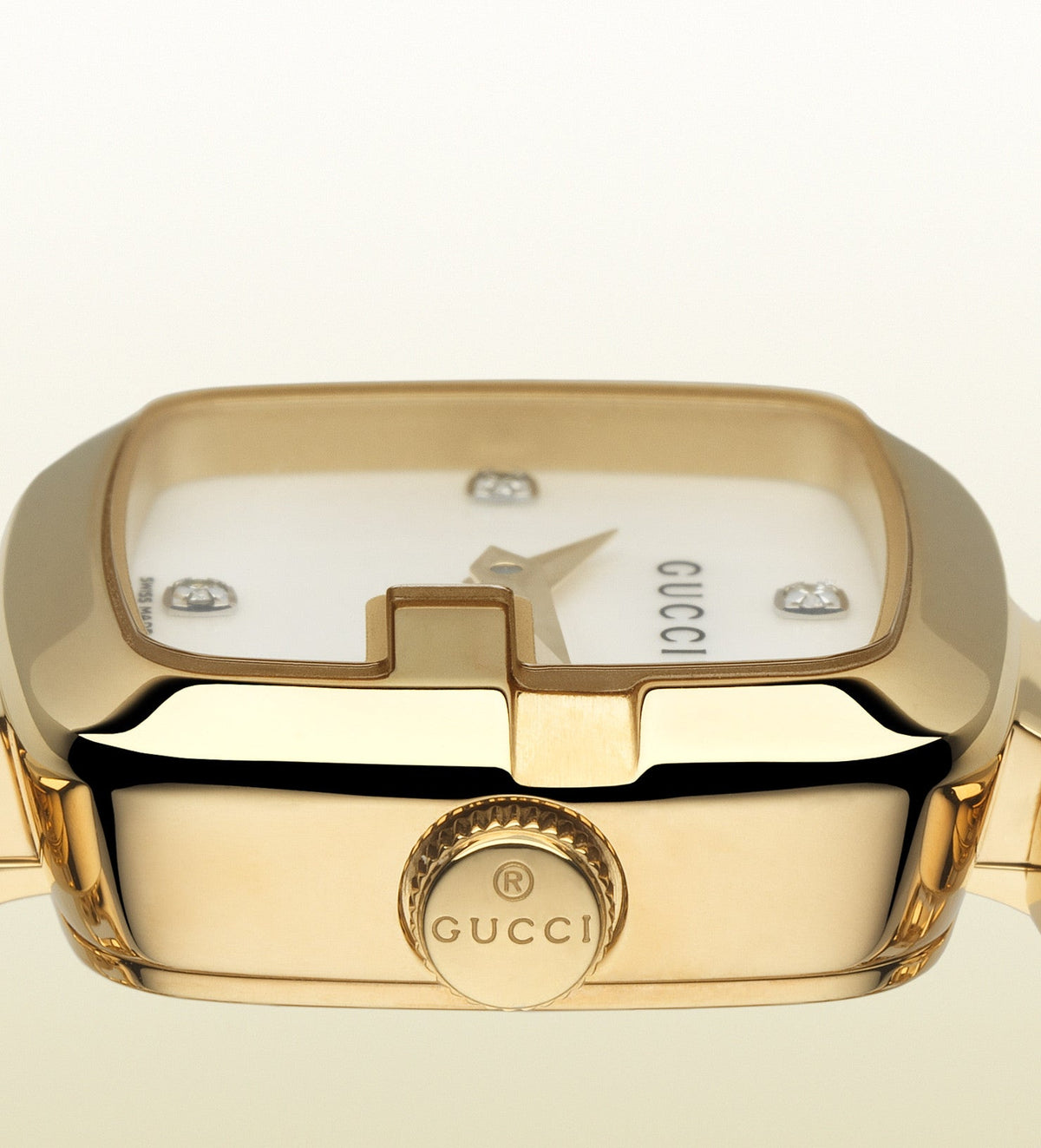 Close-up of Gucci G-Gucci Diamonds watch dial showing mother of pearl and diamond details