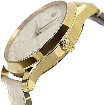 Side angle view of Gucci G-Timeless watch showing gold case profile and strap