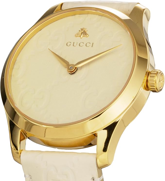 Gucci G-Timeless watch front view with white dial, gold hands, and gold-plated case