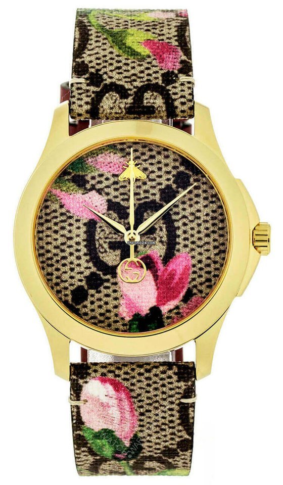 Gucci G-Timeless gold tone watch with pink floral print dial and matching canvas strap