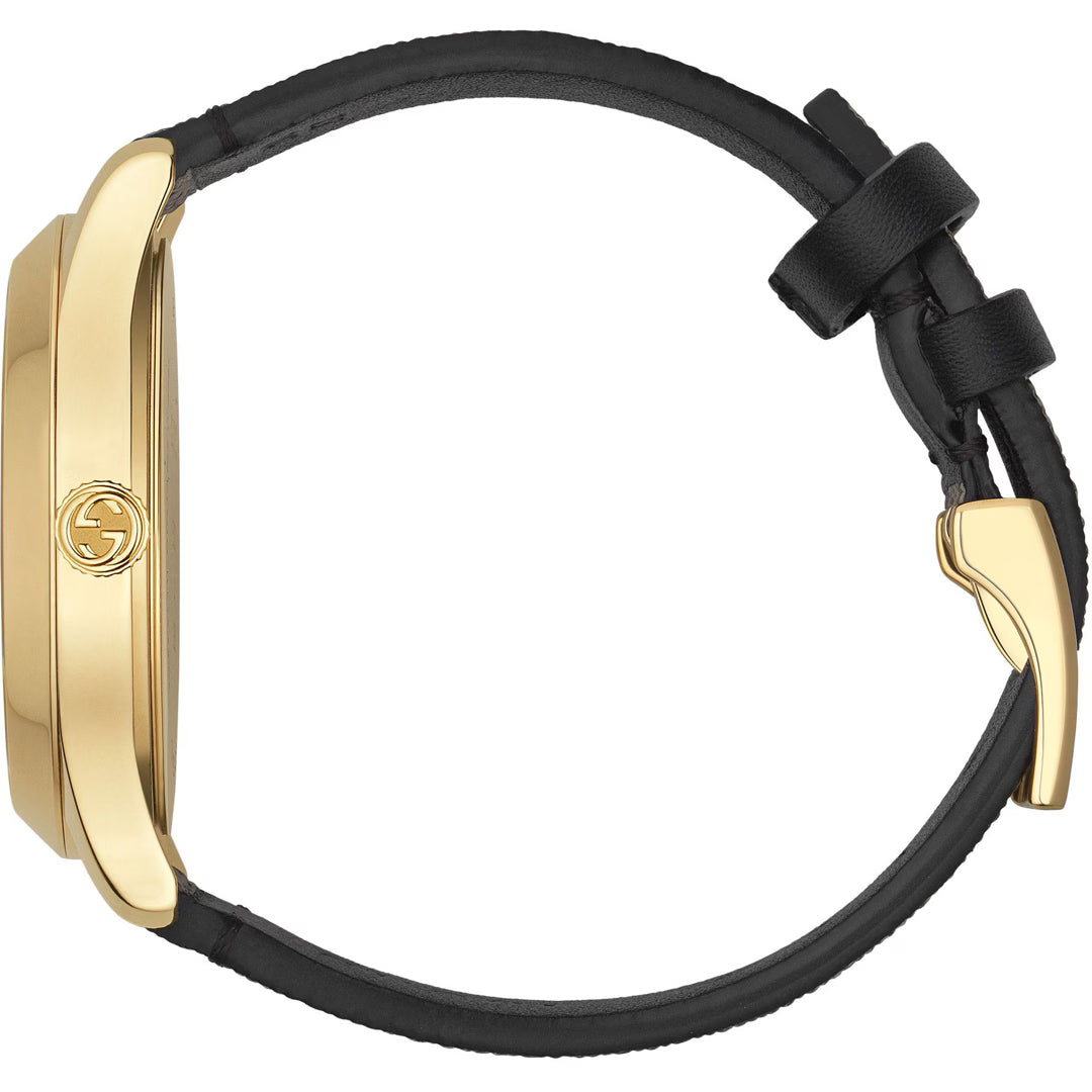 Side profile of Gucci G-Timeless watch with gold case and brown leather strap