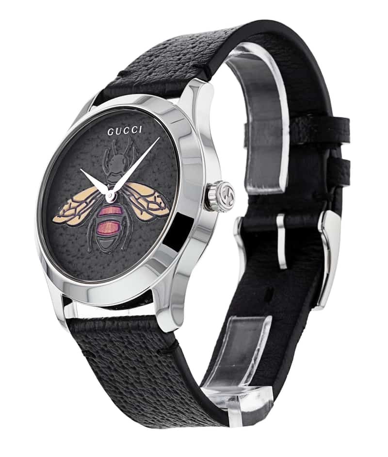Gucci G-Timeless ladies watch shown at angle with silver case and black textured leather strap