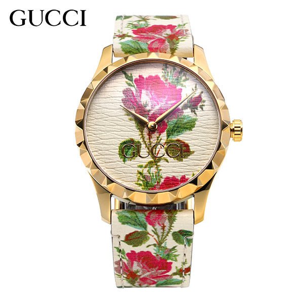 Gucci G Timeless watch with gold bezel and cream floral print dial and strap