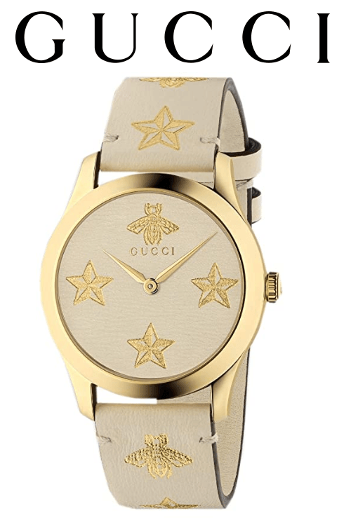 Gucci G-Timeless watch with cream leather strap and gold-tone case with logo text