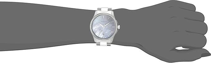 Gucci G-Timeless mother of pearl watch worn on wrist