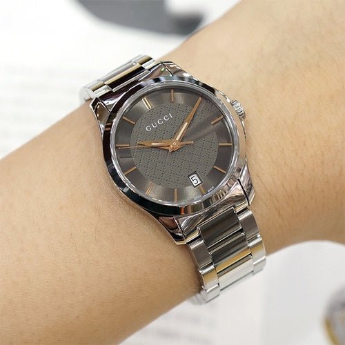 Gucci G-Timeless YA126529 worn on wrist showing brown dial with date window