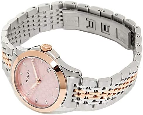 Gucci G Timeless watch worn on wrist displaying pink dial and two-tone metal bracelet