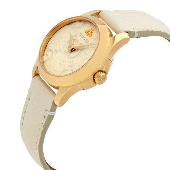 Gucci G-Timeless women's watch angled view displaying white dial and cream leather band