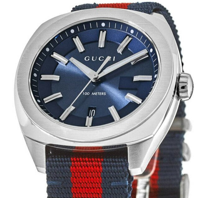 Gucci GG2570 dial detail showing applied baton markers, 100 meters waterproofing marking