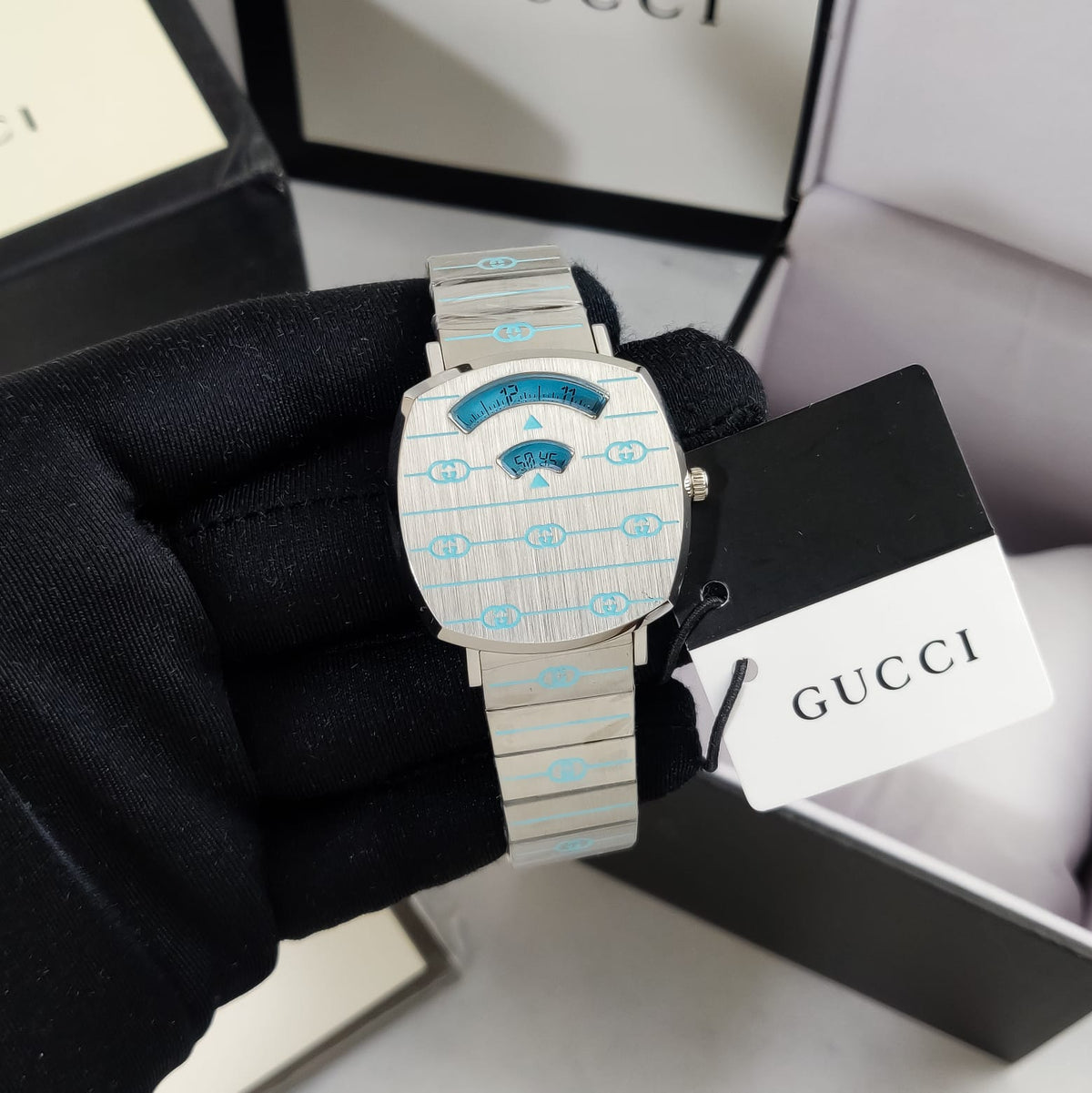 Gucci Grip watch presented in Gucci box packaging with branded tag
