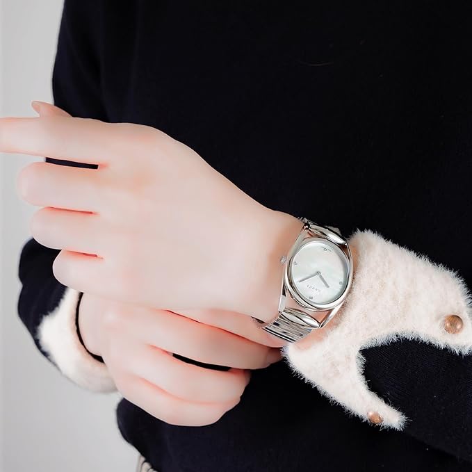 Gucci Horsebit white pearl dial watch worn on wrist with stainless steel bracelet