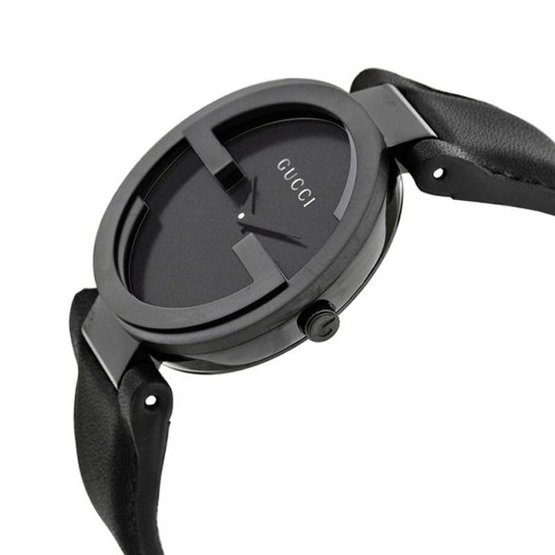Side angle view of Gucci Interlocking G watch with black dial and leather strap