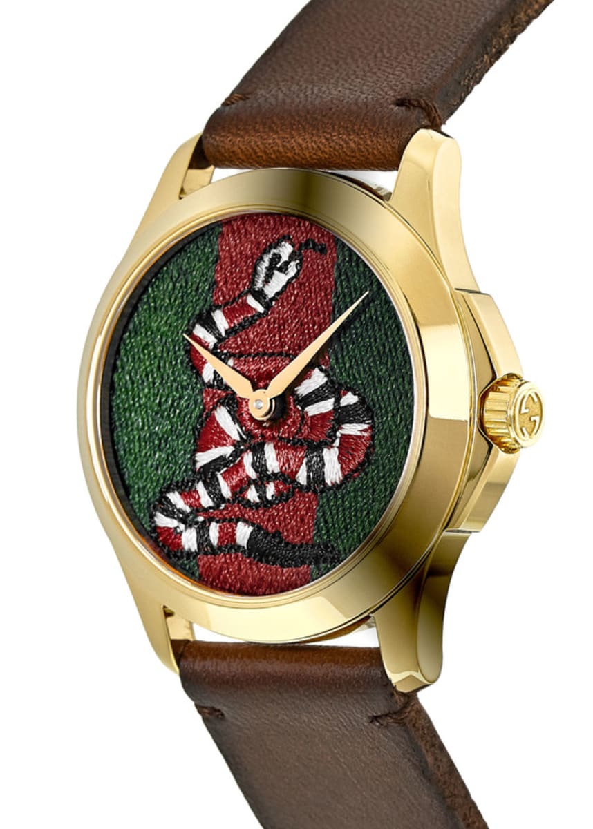 Side view of Gucci Le Marche Des Merveilles showing watch profile and embroidered dial
