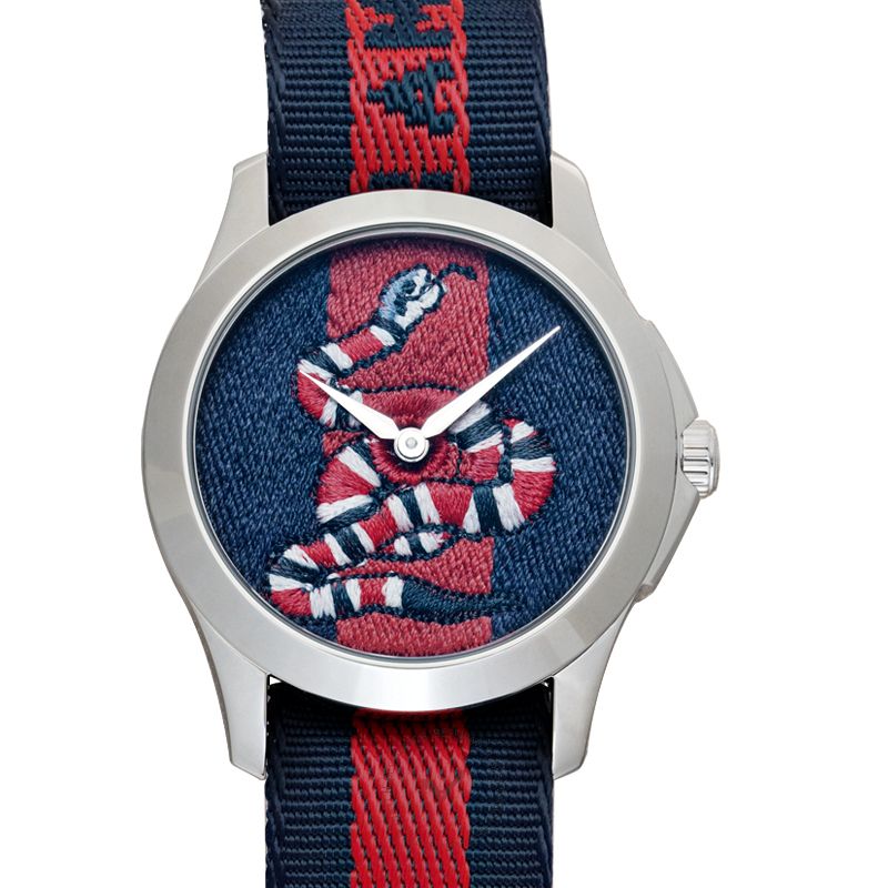 Gucci Le Marche Des Merveilles timepiece with navy-red striped nylon strap and snake dial