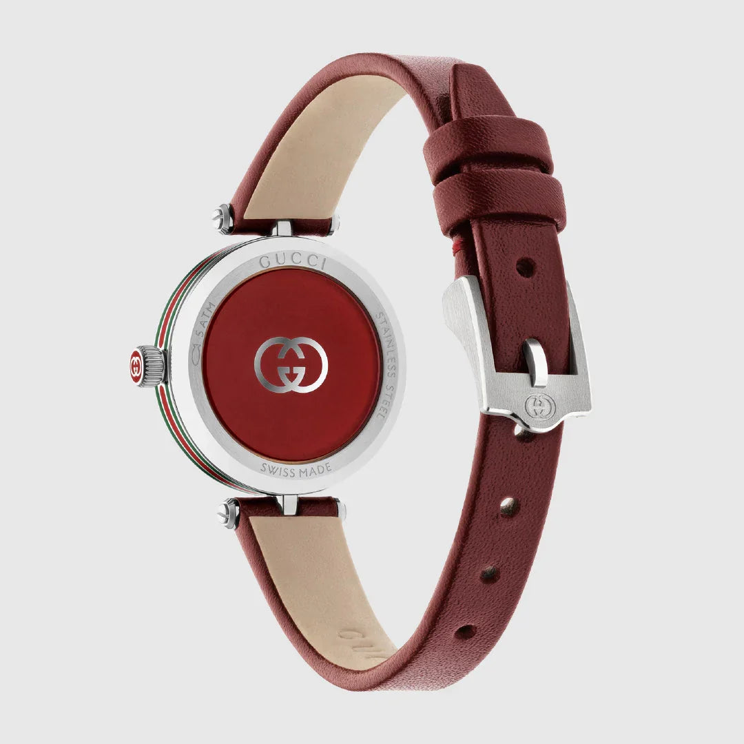 Gucci Model 2000 watch angled view showcasing red dial with Gucci GG logo and burgundy strap