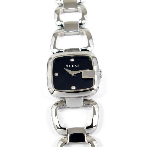 Gucci YA125509 dial detail with black face, diamond hour markers, and logo
