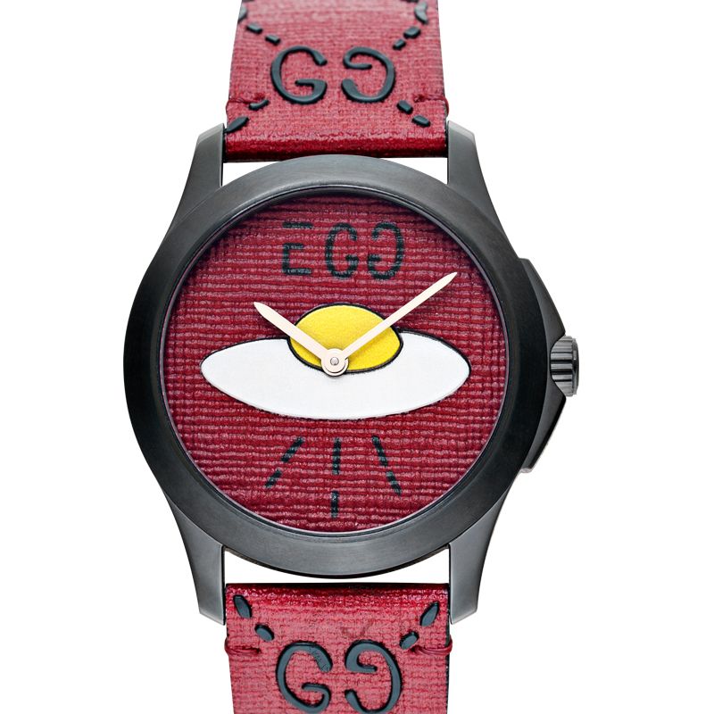 Gucci YA1264023 dial detail showing UFO eye design with yellow and white elements