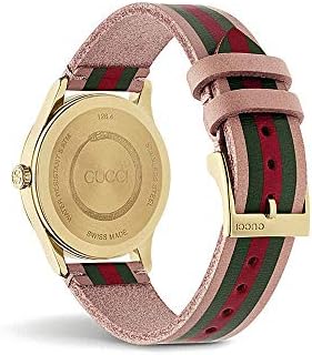 Gucci G-Timeless YA1264118 watch worn showing gold case and striped leather band on wrist