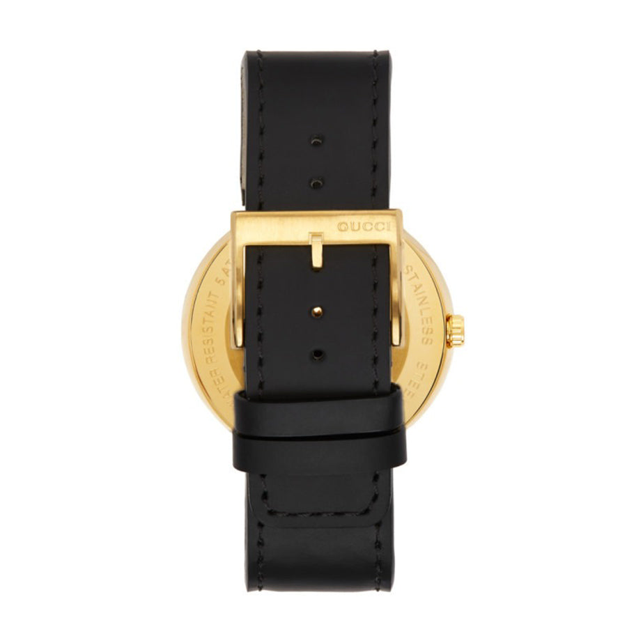 Gucci Interlocking G watch worn on wrist with black leather strap