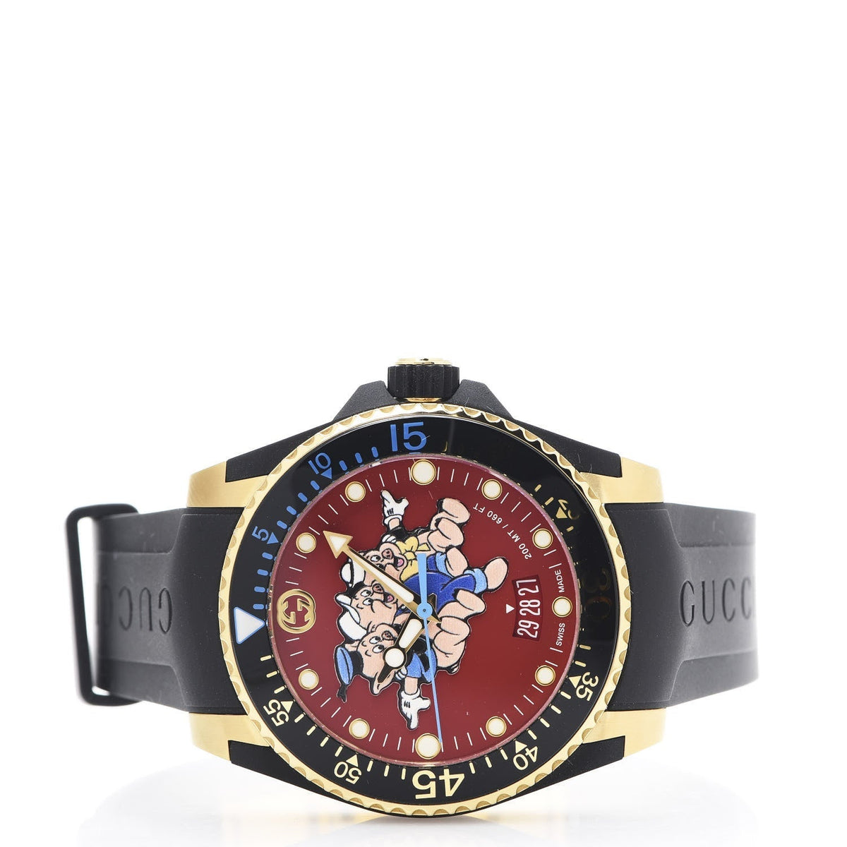 Gucci Dive watch on wrist view displaying red dial and gold-tone case