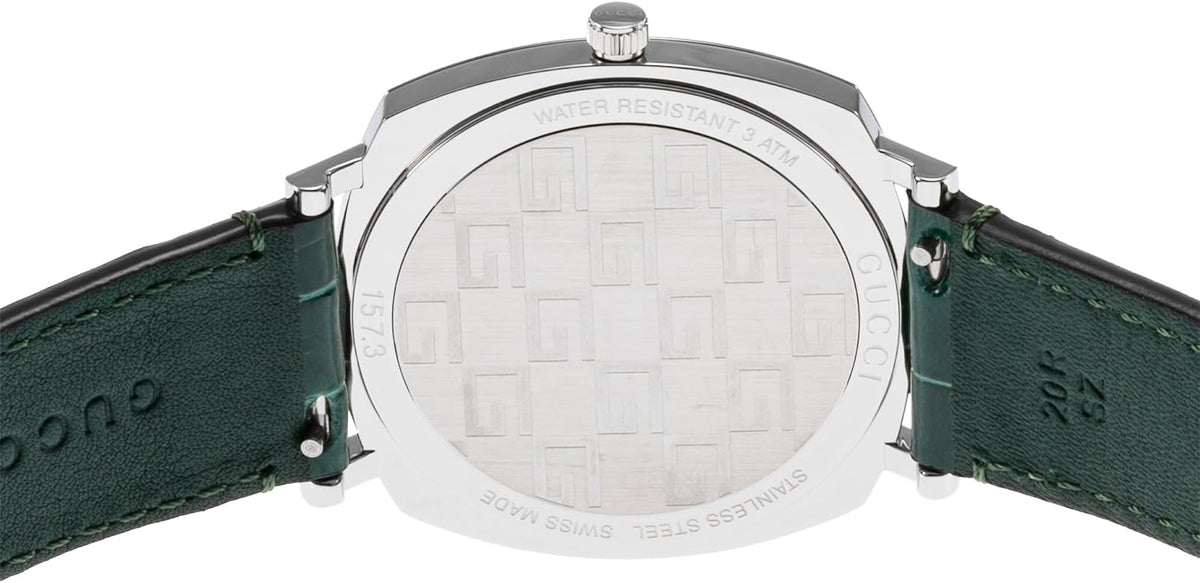 Gucci Grip watch showing caseback with green leather strap and embossed details