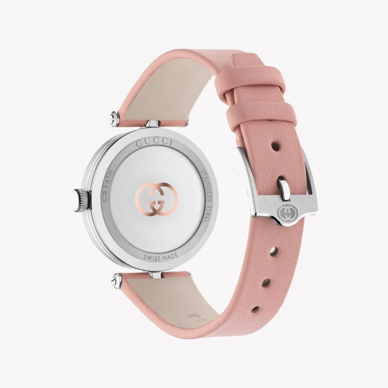 Angled view of Gucci watch displaying silver case, dial and pink leather strap with adjustment holes