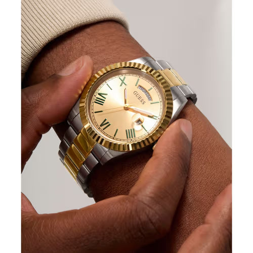 Close-up of GUESS Connoisseur watch on wrist with hands holding dial