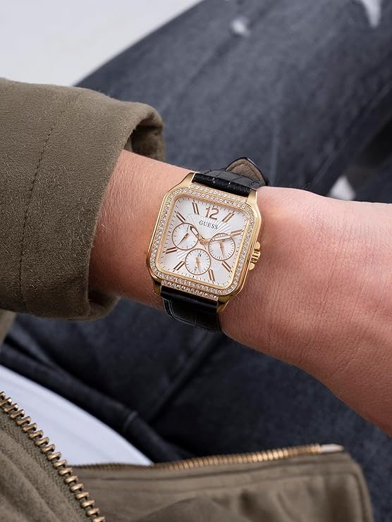 Guess Deco watch on wrist showing white dial and gold square case