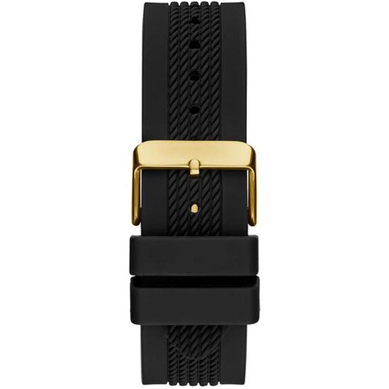 Close-up of black silicone strap with gold-tone buckle and textured pattern