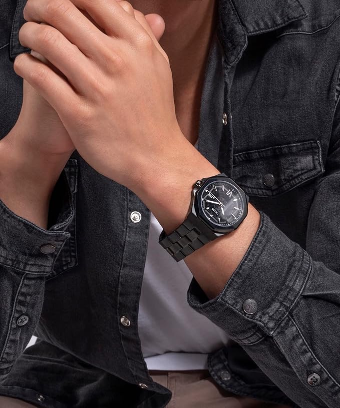 GUESS EMPEROR black watch worn on wrist over denim shirt